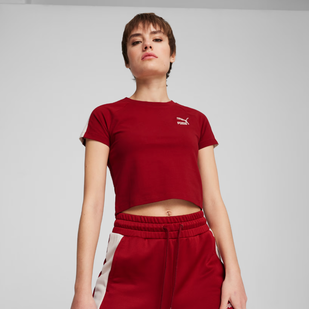 woman wearing a red cropped t-shirt and red track pants