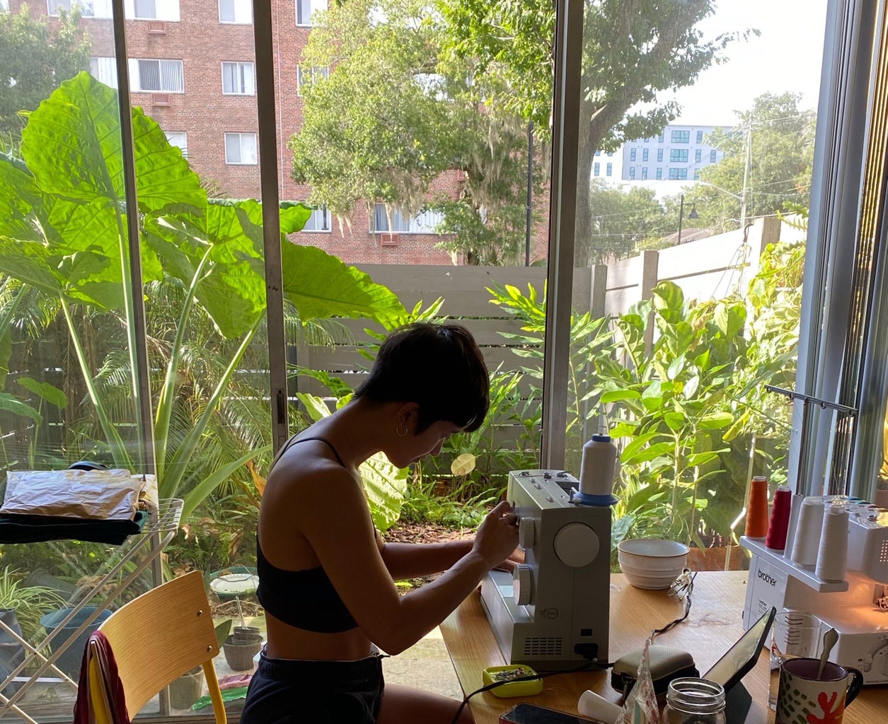 Mia Crisosto working on her sewing machine.