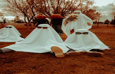 ghosts with sunglasses and pumpkin heads