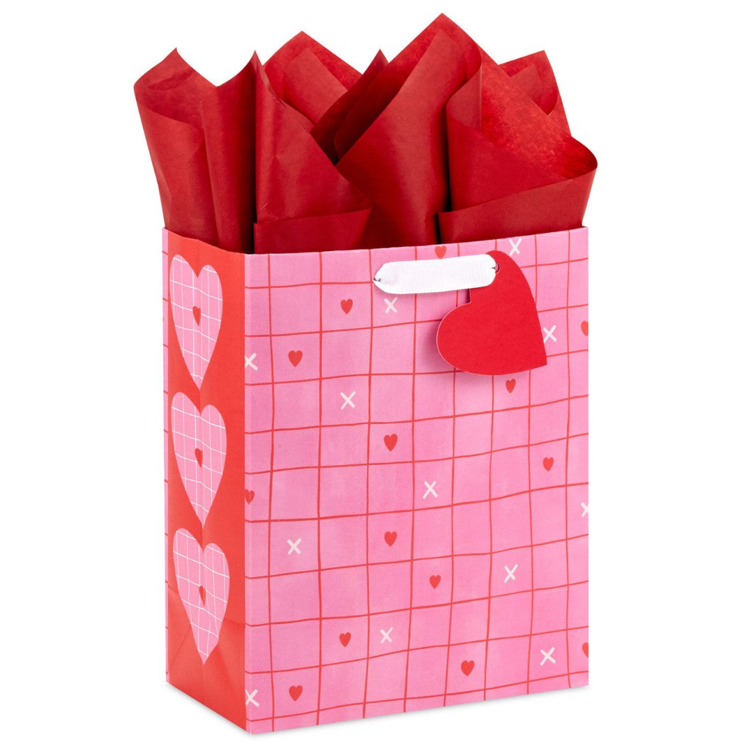 pink and red gift bag with grid and heart illustrations