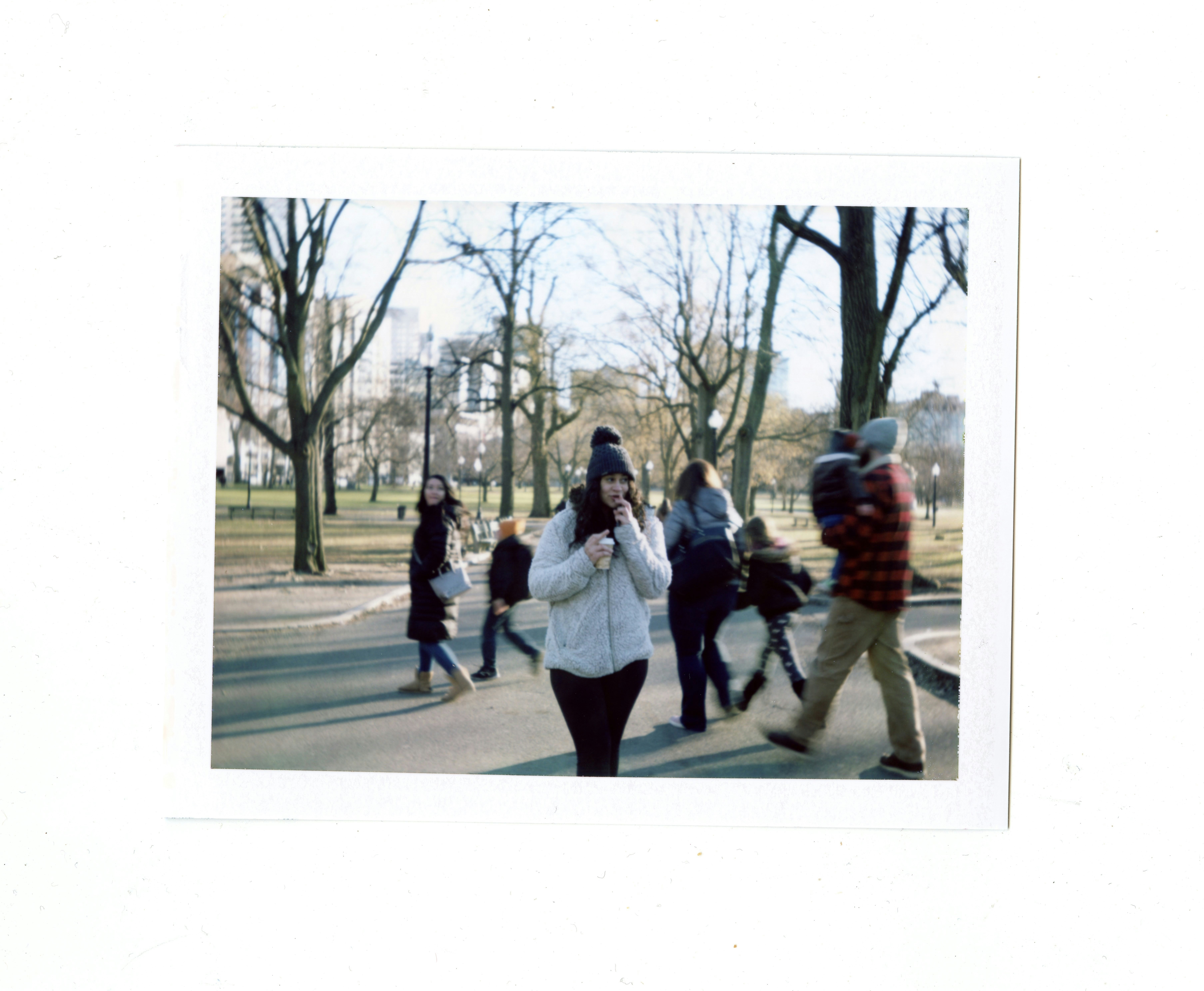polaroid picture of a girl in a park